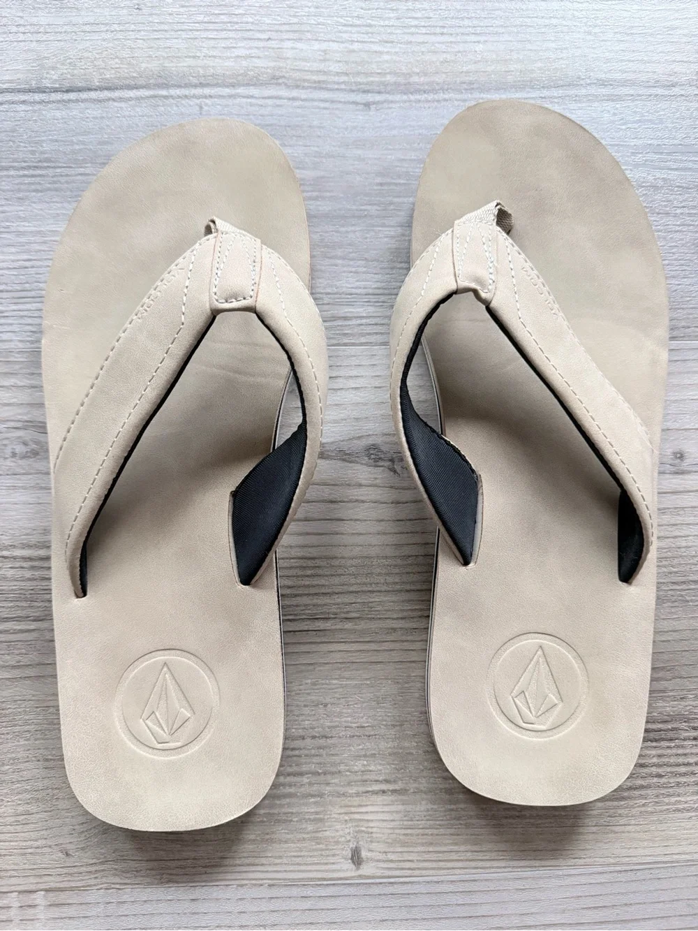 Men’s tan Volcom flip flops